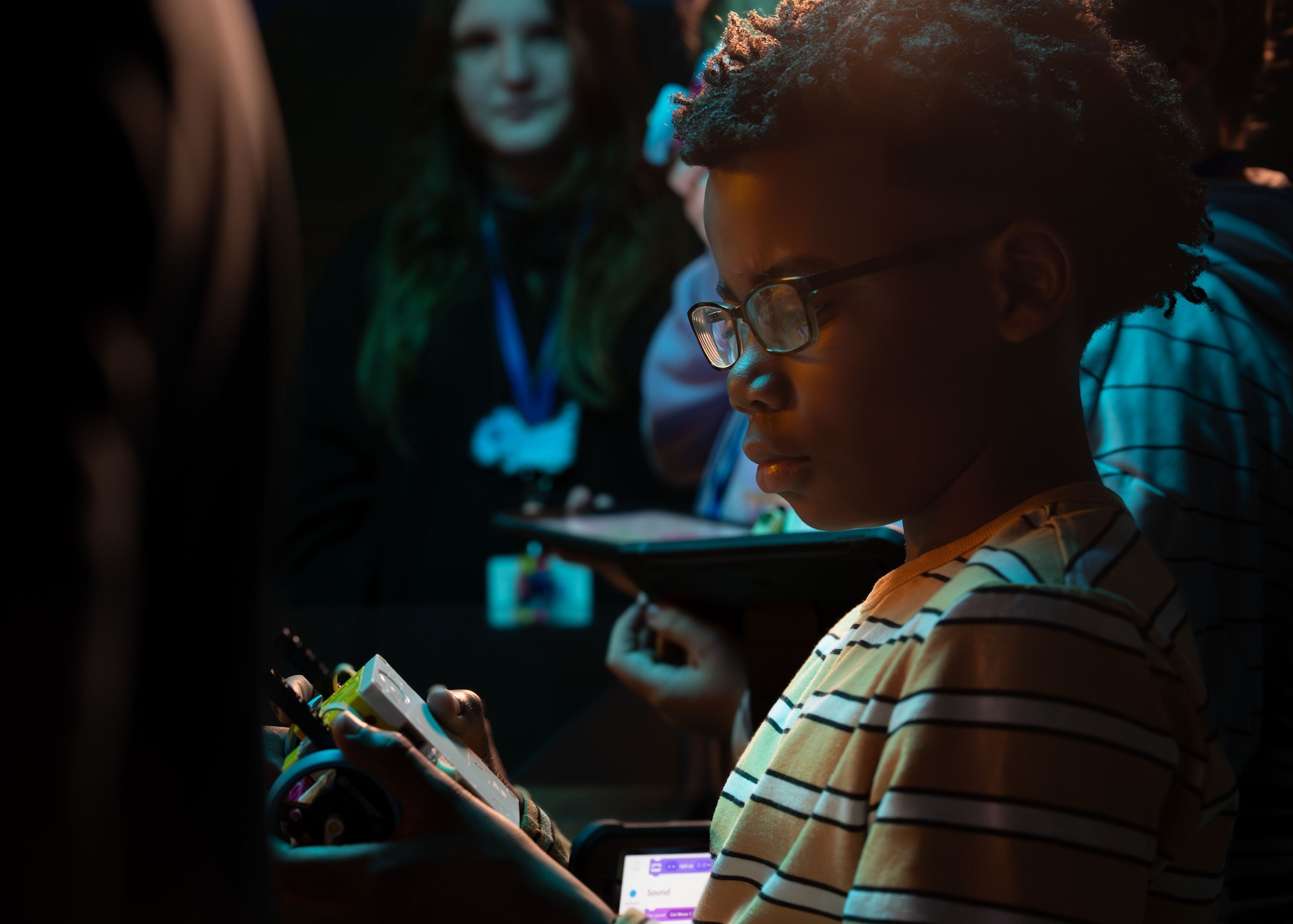 A student looks at a programmable robot during a lesson at Maxwell Air Force Base, Alabama, Feb. 11, 2026.