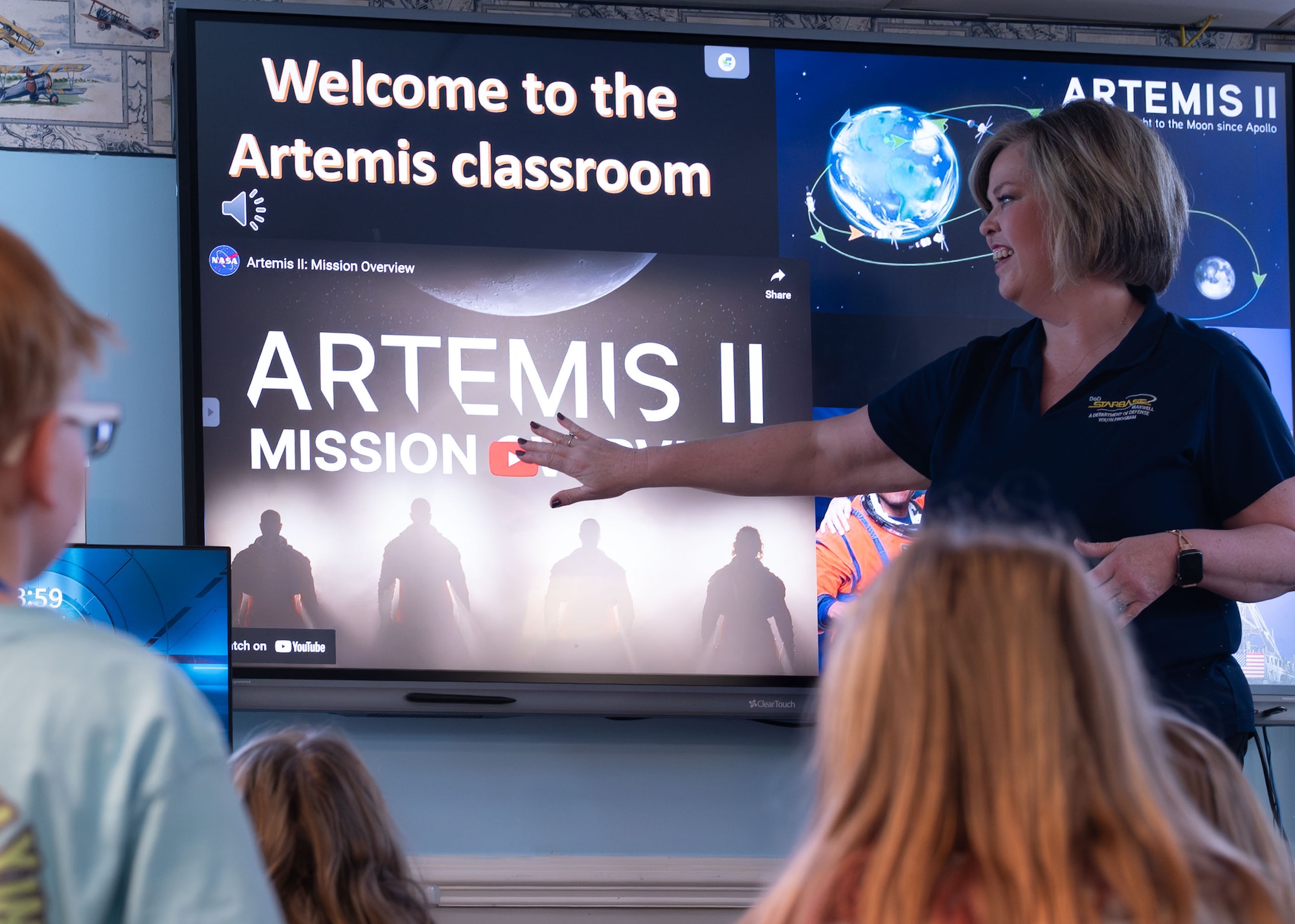Lisa West, STARBASE Maxwell instructor, puts on a video for students on the Artemis II mission overview, at Maxwell Air Force Base, Alabama, Feb. 12, 2026.