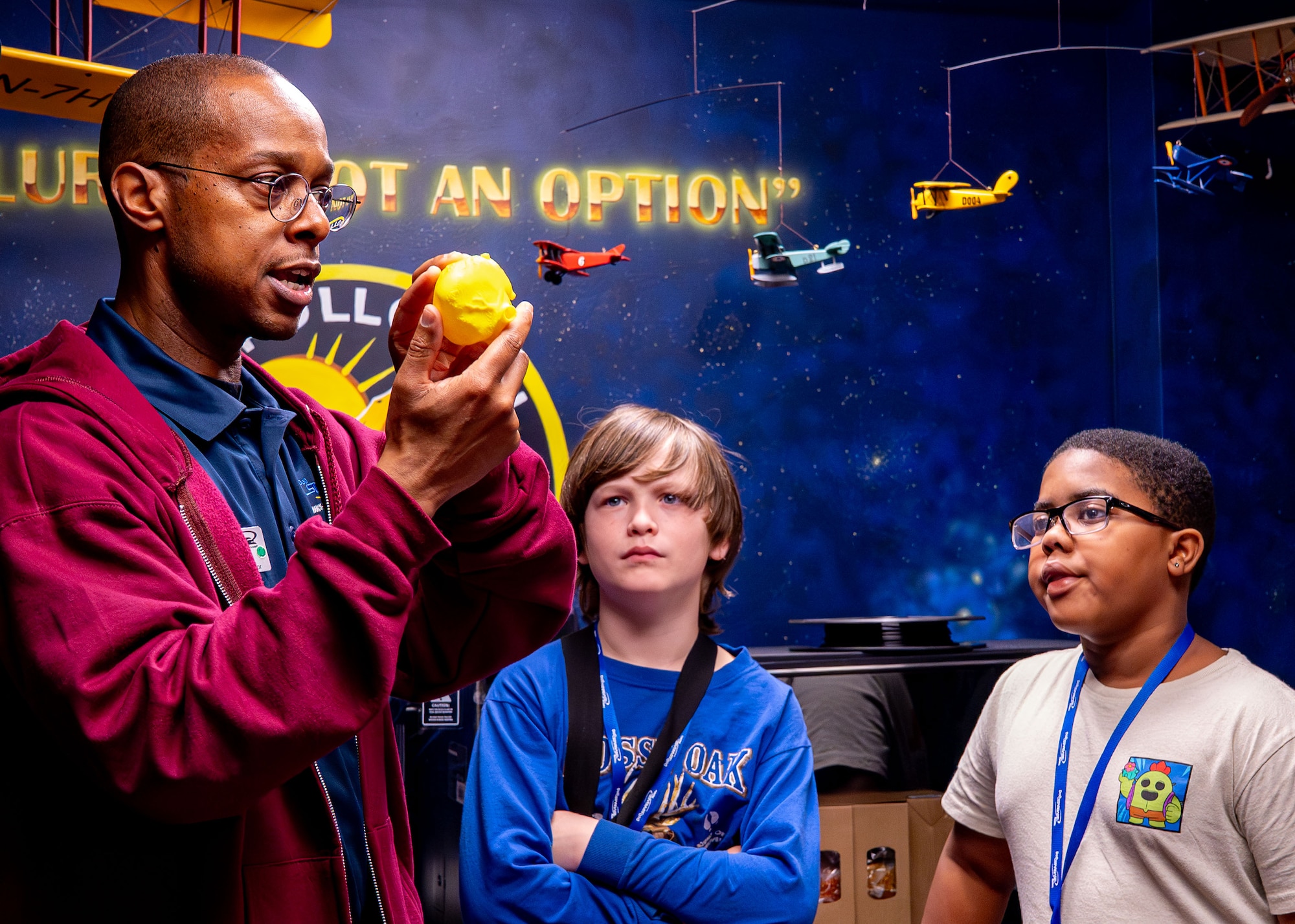 Andrew Roberts, STARBASE Maxwell instructor, holds a 3D printed heart and speaks to students at Maxwell Air Force Base, Alabama, Feb. 11, 2026.