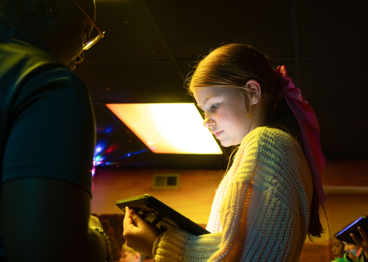A student inputs a navigation code into a tablet to control a custom-built robot at Maxwell Air Force Base, Alabama, Feb. 11, 2026.