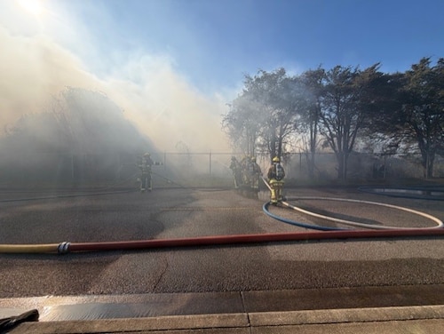 Firefighters from Maxwell-Gunter and Montgomery works together to contain an off-base fire at Gunter Annex, Alabama, Feb. 01, 2026.