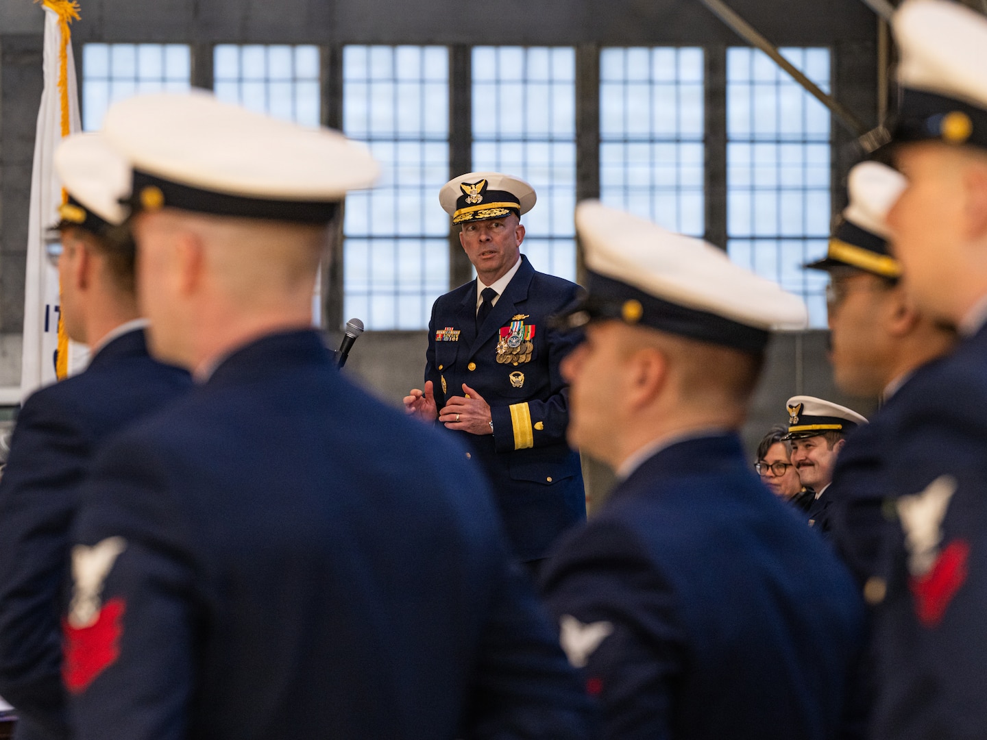 Rear Adm. Bob Little, commander of the Coast Guard’s Arctic District, delivers a speech during the commissioning ceremony for Coast Guard Cutter Frederick Mann (WPC 1160), at Base Kodiak, Alaska, Feb. 13, 2026. The Mann is the sixth fast response cutter to be homeported in Alaska to support missions in search and rescue, living marine resources, and maritime law enforcement. (U.S. Coast Guard photo by Petty Officer 3rd Class Cameron Snell)