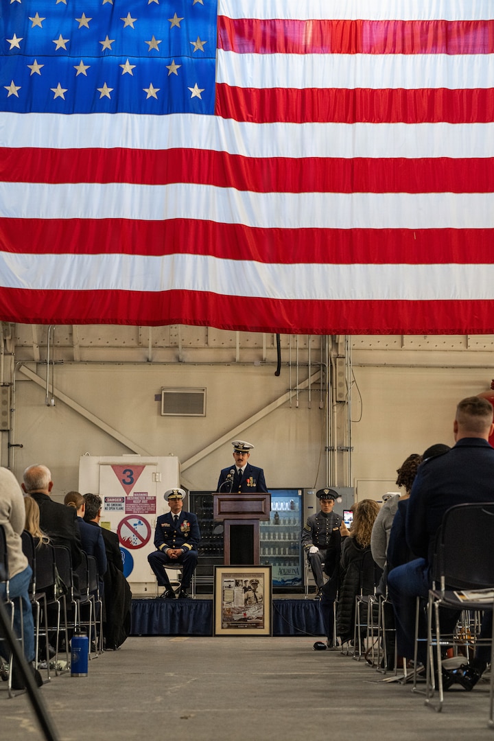Lt. Jakob Daubert, commanding officer of Coast Guard Cutter Frederick Mann (WPC 1160), delivers a speech to assume command of the Mann during the cutter's commissioning ceremony at Base Kodiak, Alaska, Feb. 13, 2026. The commissioning solidified the Mann as the sixth fast response cutter to be homeported in Alaska to support missions in search and rescue, living marine resources, and maritime law enforcement. (U.S. Coast Guard photo by Petty Officer 3rd Class Cameron Snell)