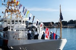 The Coast Guard Cutter Frederick Mann (WPC 1160) displays signal flags after the cutter's commissioning ceremony at Coast Guard Base Kodiak, Alaska, Feb. 13, 2026. The commissioning solidified the Mann as the sixth fast response cutter to be homeported in Alaska, and it was presided over by Rear Adm. Bob Little, commander of the Coast Guard’s Arctic District. (U.S. Coast Guard photo by Petty Officer 3rd Class Cameron Snell)