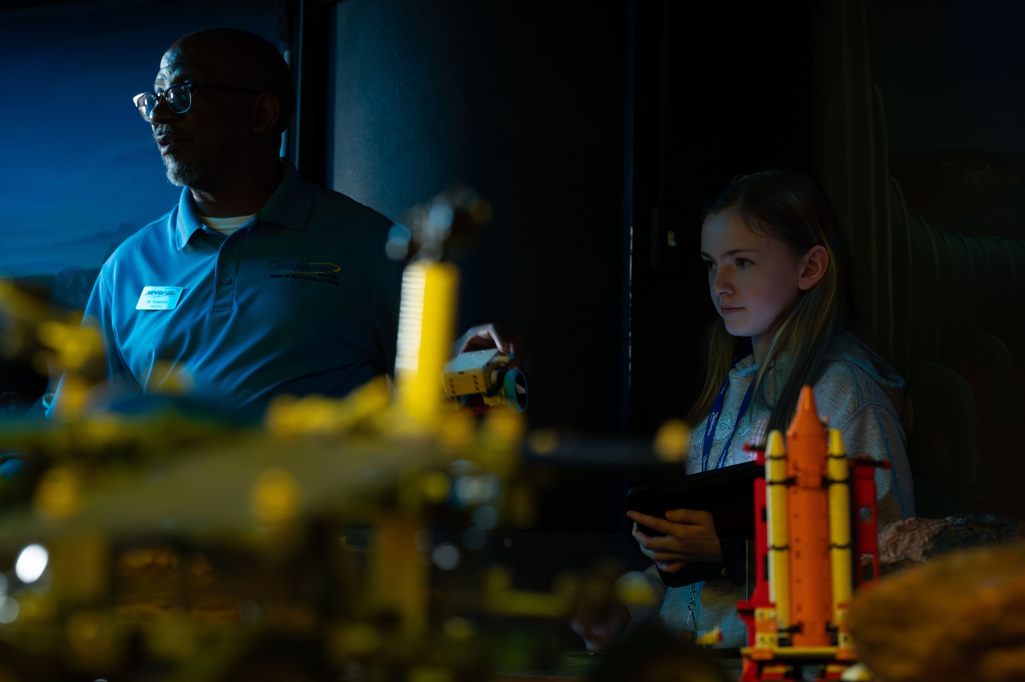 Darrin Roberson, STARBASE Maxwell instructor, assists a student during a lesson at Maxwell Air Force Base, Alabama, Feb. 12, 2026.