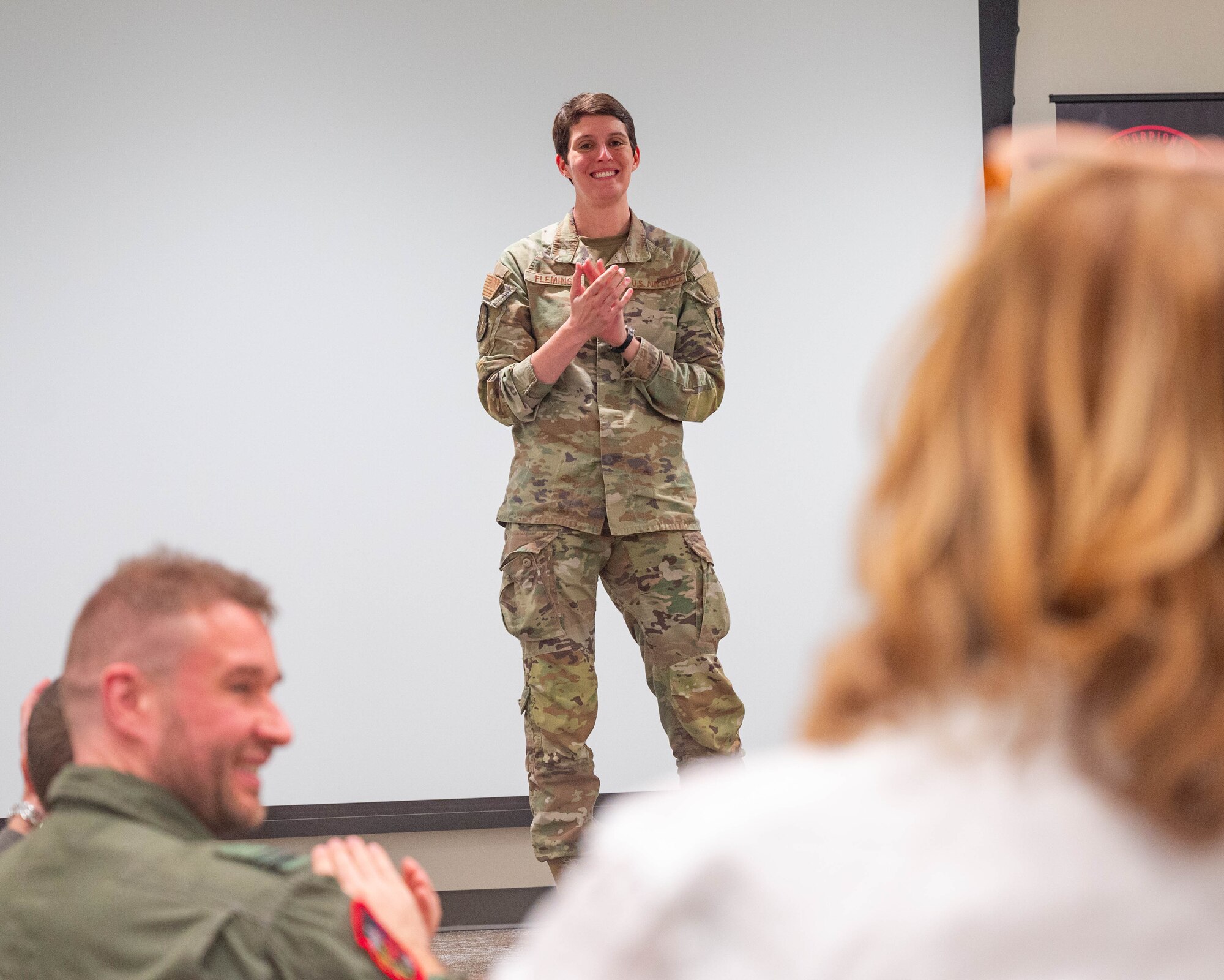 U.S. Air Force Capt. Julie Fleming, 56th Operations Support Squadron chief of combat intelligence cell, introduces a F-35 International Intelligence Formal Training Unit graduate's mother to a graduation ceremony, Feb. 11, 2026, at Luke Air Force Base, Arizona.