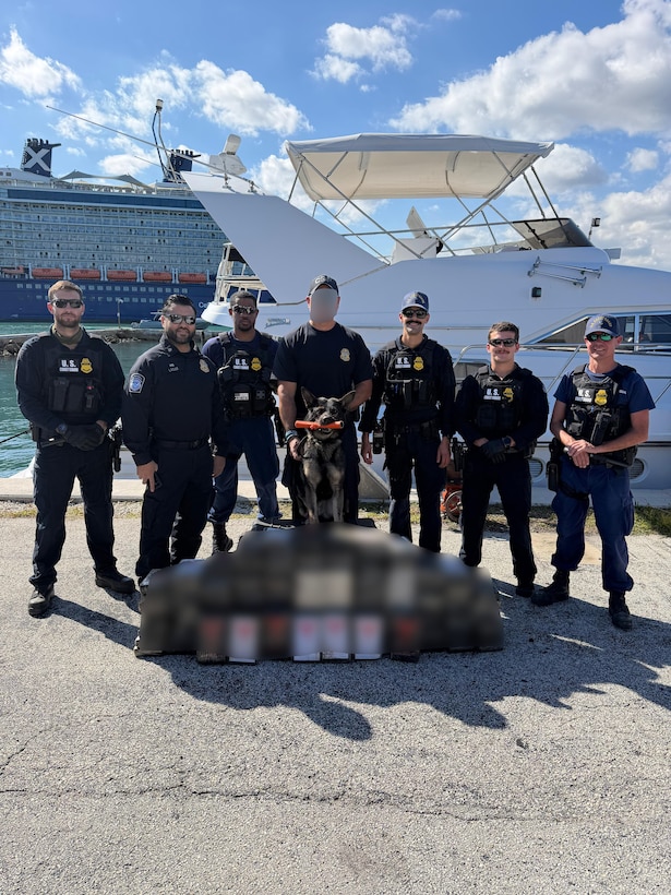 A Coast Guard Station Fort Lauderdale law enforcement crew and a Customs and Border Protection Office of Field Operations K9 unit team pose for a photo on the pier in Fort Lauderdale, Florida, Feb. 9, 2026. Coast Guard Station Fort Lauderdale's law enforcement crew interdicted approximately $5.6 million in illicit narcotics. (U.S. Coast Guard photo by Station Fort Lauderdale's crew)