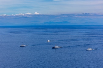 From left, Royal Australian Navy Anzac-class frigate HMAS Toowoomba (FFH 156), Philippine Coast Guard Teresa Magbanua-class patrol vessel BRP Teresa Magbanua (MRRV 9701), U.S. Navy Arleigh Burke-class guided-missile destroyer USS Dewey
 (DDG 105) and Philippine Navy Jose Miguel Malvar-class guided-missile frigate BRP Diego Silang (FFG 07) sail in formation during the Maritime Cooperative Activity (MCA) in the Philippines' Exclusive Economic Zone, Feb. 16, 2026.