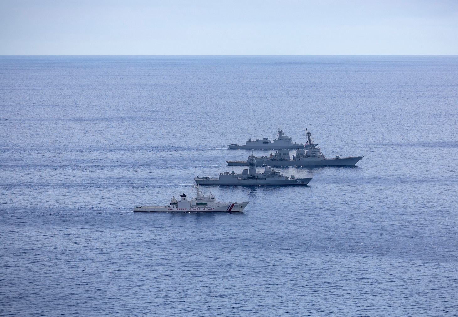 From front, Philippine Coast Guard Teresa Magbanua-class patrol vessel BRP Teresa Magbanua (MRRV 9701), Royal Australian Navy Anzac-class frigate HMAS Toowoomba (FFH 156), U.S. Navy Arleigh Burke-class guided-missile destroyer USS Dewey (DDG 105) and Philippine Navy Jose Miguel Malvar-class guided-missile frigate BRP Diego Silang (FFG 07) sail in formation during the Maritime Cooperative Activity (MCA) in the Philippines' Exclusive Economic Zone, Feb. 16, 2026. The U.S. Navy routinely operates with the Armed Forces of the Philippines and partners and allies through MCAs to continually develop, exercise and enhance multi-domain tactical interoperability to uphold peace and security in the region. Dewey is forward-deployed and assigned to Destroyer Squadron (DESRON) 15, the Navy’s largest DESRON and the U.S. 7th Fleet’s principal surface force. (U.S. Navy photo by Mass Communication Specialist 2nd Class Oscar Diaz)