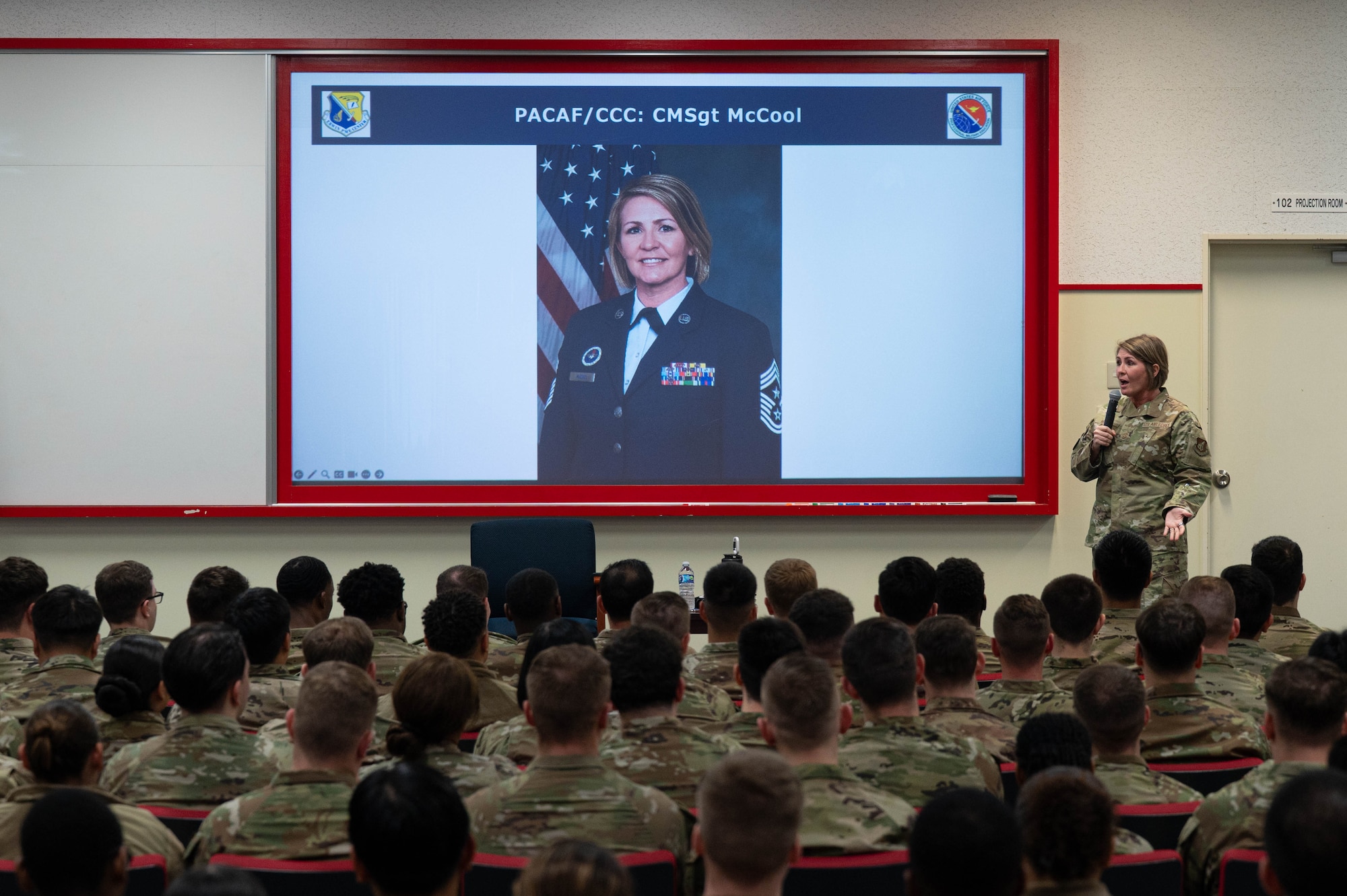 Chief Master Sgt. Katie McCool, Pacific Air Forces command chief, speaks with airmen attending Airmen Leadership School