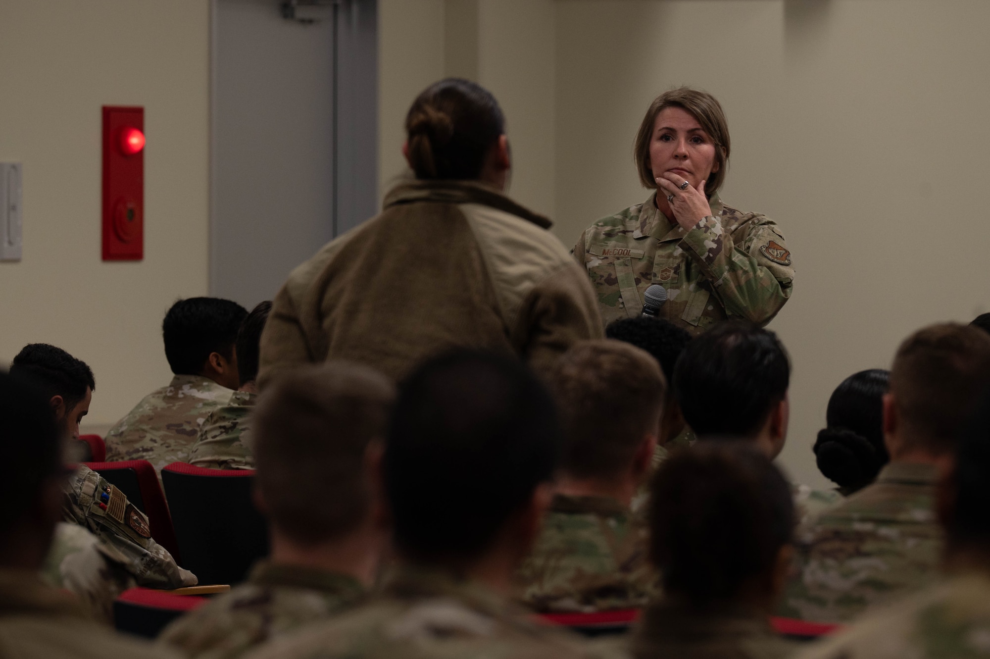 Chief Master Sgt. Katie McCool, Pacific Air Forces command chief, listens to a question from a student attending Airmen Leadership School