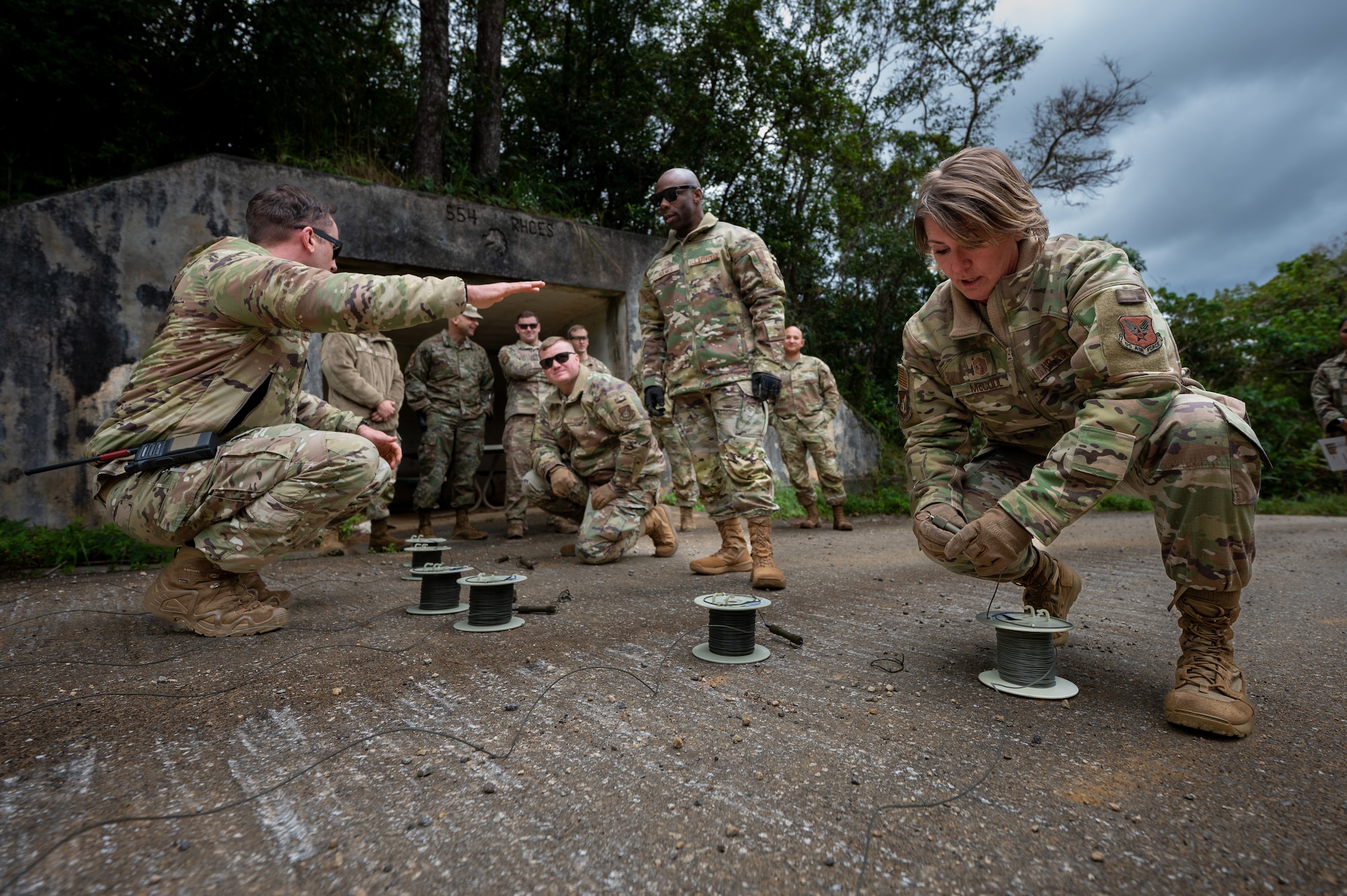 Chief Master Sgt. Kathleen McCool, Pacific Air Forces command chief participates in an EOD demonstration