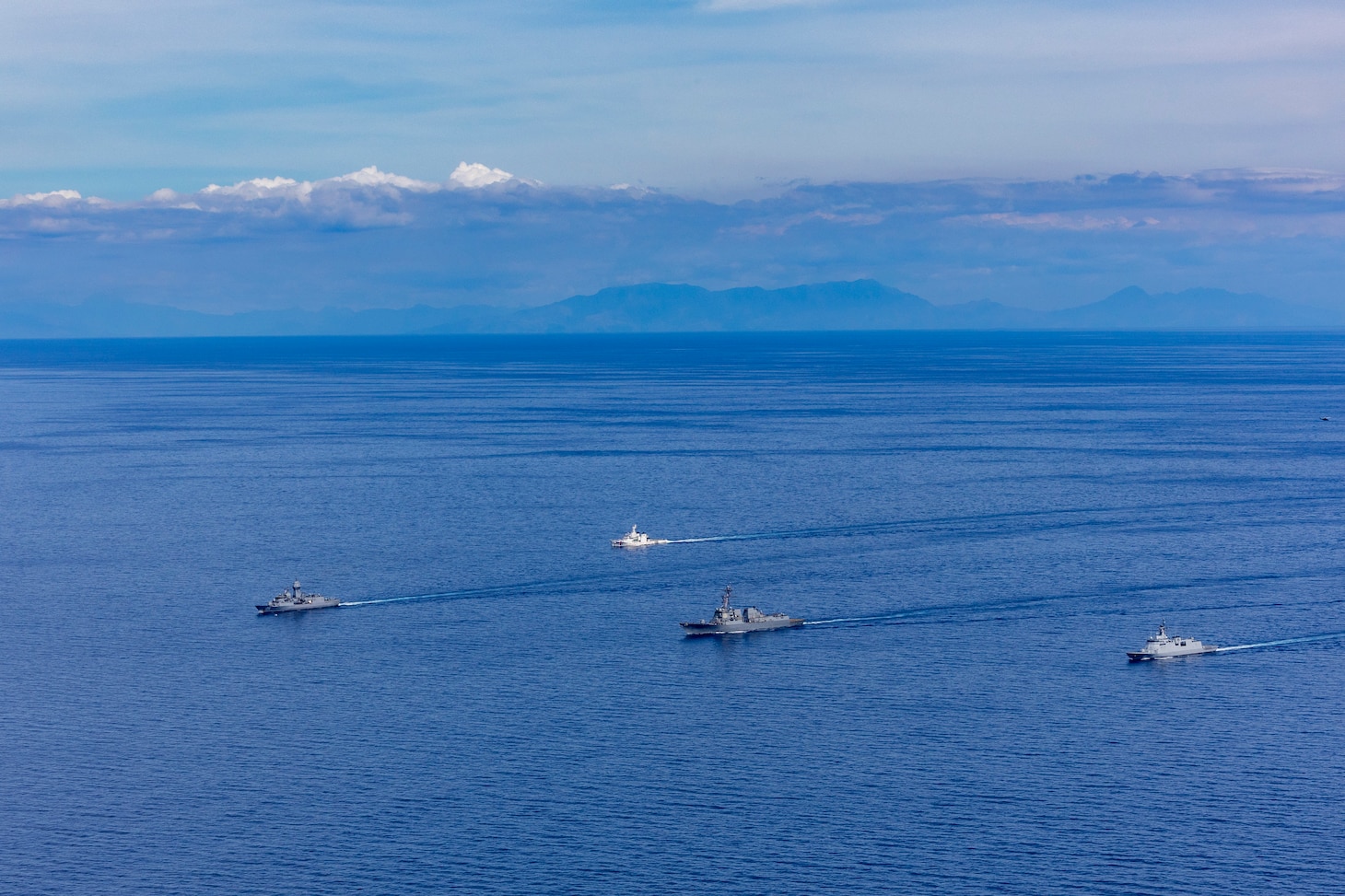 From left, Royal Australian Navy Anzac-class frigate HMAS Toowoomba (FFH 156), Philippine Coast Guard Teresa Magbanua-class patrol vessel BRP Teresa Magbanua (MRRV 9701), U.S. Navy Arleigh Burke-class guided-missile destroyer USS Dewey
 (DDG 105) and Philippine Navy Jose Miguel Malvar-class guided-missile frigate BRP Diego Silang (FFG 07) sail in formation during the Maritime Cooperative Activity (MCA) in the Philippines' Exclusive Economic Zone, Feb. 16, 2026.