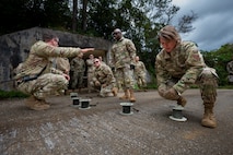 Chief Master Sgt. Kathleen McCool, Pacific Air Forces command chief participates in an EOD demonstration
