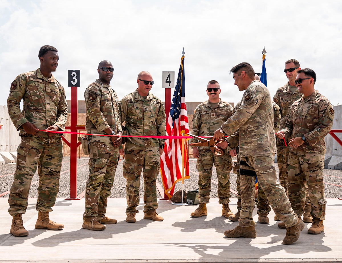 U.S. Air Force Airmen assigned to the 776th Expeditionary Air Base Squadron participate in a ribbon cutting ceremony marking the opening of the first on-site small arms range  at Chabelley Airfield, Djibouti