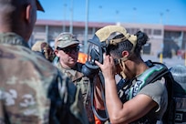 U.S. Air Force Reserve Staff Sgt. Sara Weaver, 944th Civil Engineering Squadron Emergency Management, assists U.S. Air Force Airman Jimi Richardson, 56th Fighter Wing Emergency Management, for a chemical, biological, radiological, nuclear, or explosives (CBRNE) field training exercise at Goldwater Air National Guard base, Phoenix, Feb. 14, 2026.