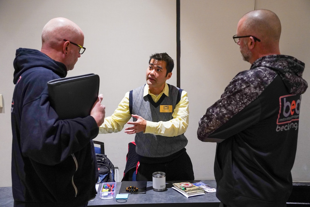 U.S. Army Corps of Engineers Louisville District Environmental Engineer Quyet La answers questions at the Louisville District's annual Open House event held Feb. 4 in Louisville, Kentucky.