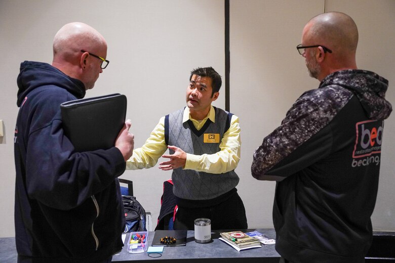 U.S. Army Corps of Engineers Louisville District Environmental Engineer Quyet La answers questions at the Louisville District's annual Open House event held Feb. 4 in Louisville, Kentucky.