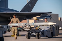 maintainers move a training missile