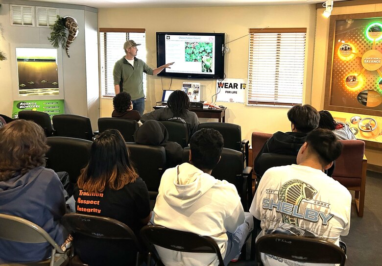 Lee Martin, Biologist, engages Dunbar High School students during a STEM outreach presentation at the W.P. Franklin South recreation area, explaining the biology and conservation of the endangered Okeechobee gourd, which is only found on Lake Okeechobee. Throughout the session, students learned how environmental science and biology are used in Martin’s day-to-day work and were able to explore another STEM-focused career path. (USACE photo by Brian Holtzinger, Natural Resources Program Manager)