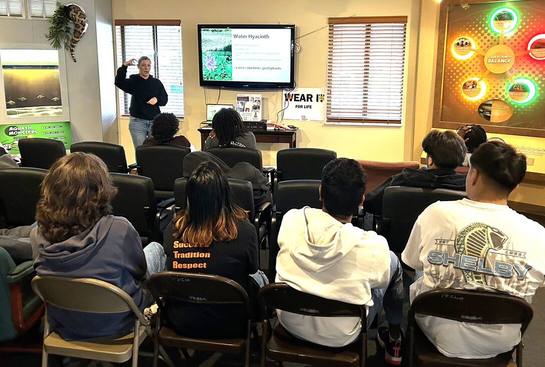 During Dunbar High School’s STEM-outreach field trip to W.P. Franklin South Recreation Area, Jessica “Skippy” Martin, Invasive Species Biologist, explains the uniqueness of her job managing invasive species plants on Lake Okeechobee and explains the negative effects water hyacinth has on the lake ecosystem as an invasive species. The outreach event had students learning about different STEM-focused career paths and how their fields of study are applied in their day-to-day jobs. (USACE photo by Brian Holtzinger, Natural Resources Program Manager)