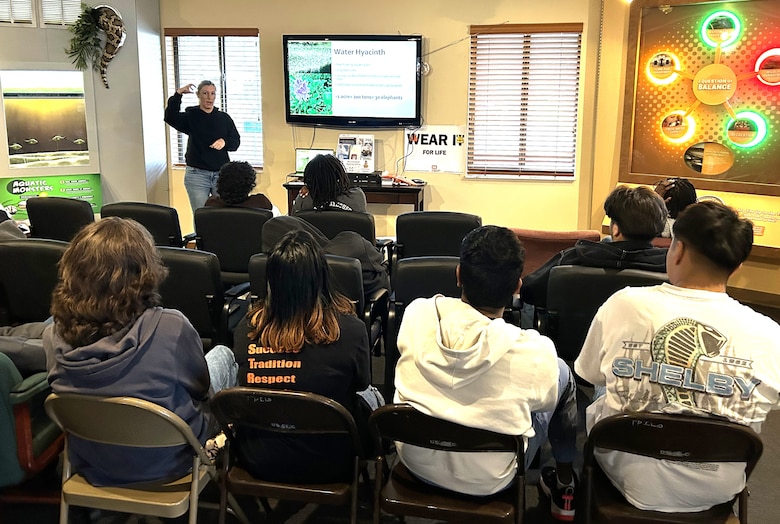 During Dunbar High School’s STEM-outreach field trip to W.P. Franklin South Recreation Area, Jessica “Skippy” Martin, Invasive Species Biologist, explains the uniqueness of her job managing invasive species plants on Lake Okeechobee and explains the negative effects water hyacinth has on the lake ecosystem as an invasive species. The outreach event had students learning about different STEM-focused career paths and how their fields of study are applied in their day-to-day jobs. (USACE photo by Brian Holtzinger, Natural Resources Program Manager)