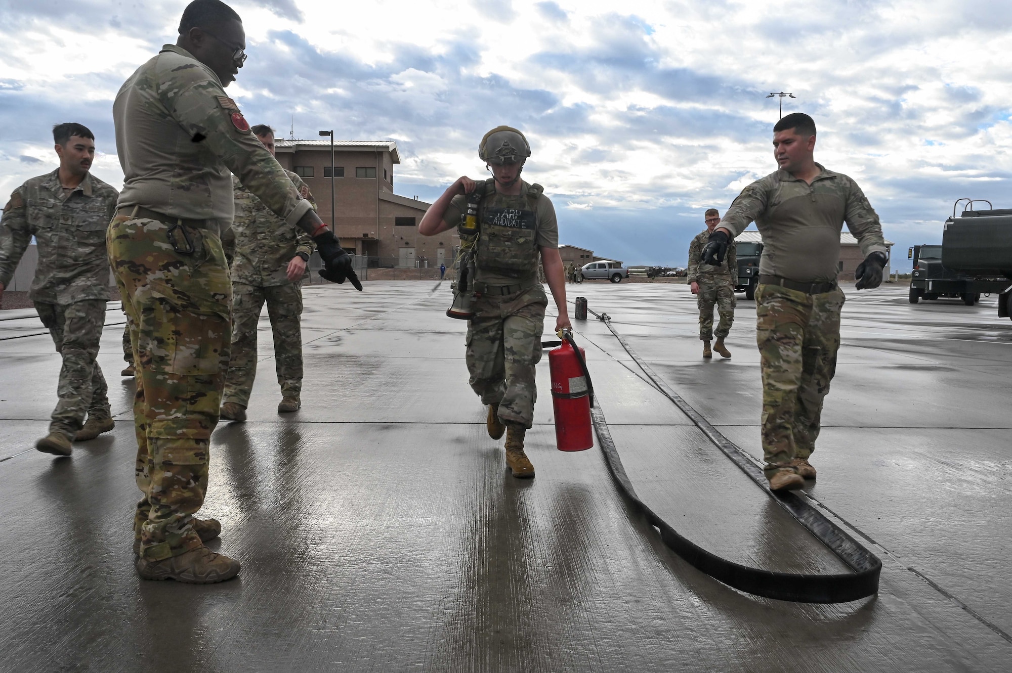 U.S. Air Force Airman 1st Class Thomas Burgess, 355th Logistics Readiness Squadron fuels distribution operator, completes an s-fold with a collapsible fuel hose during Forward Area Refueling Point team tryouts at Davis-Monthan Air Force Base, Ariz., Feb. 13, 2026. An s-fold allows space for an aircraft to park while ensuring rapid delivery of fuel. Airmen participating in the FARP tryouts are interested in becoming qualified special operations refueling technicians. (U.S. Air Force photo by Staff Sgt. Kahdija Slaughter)