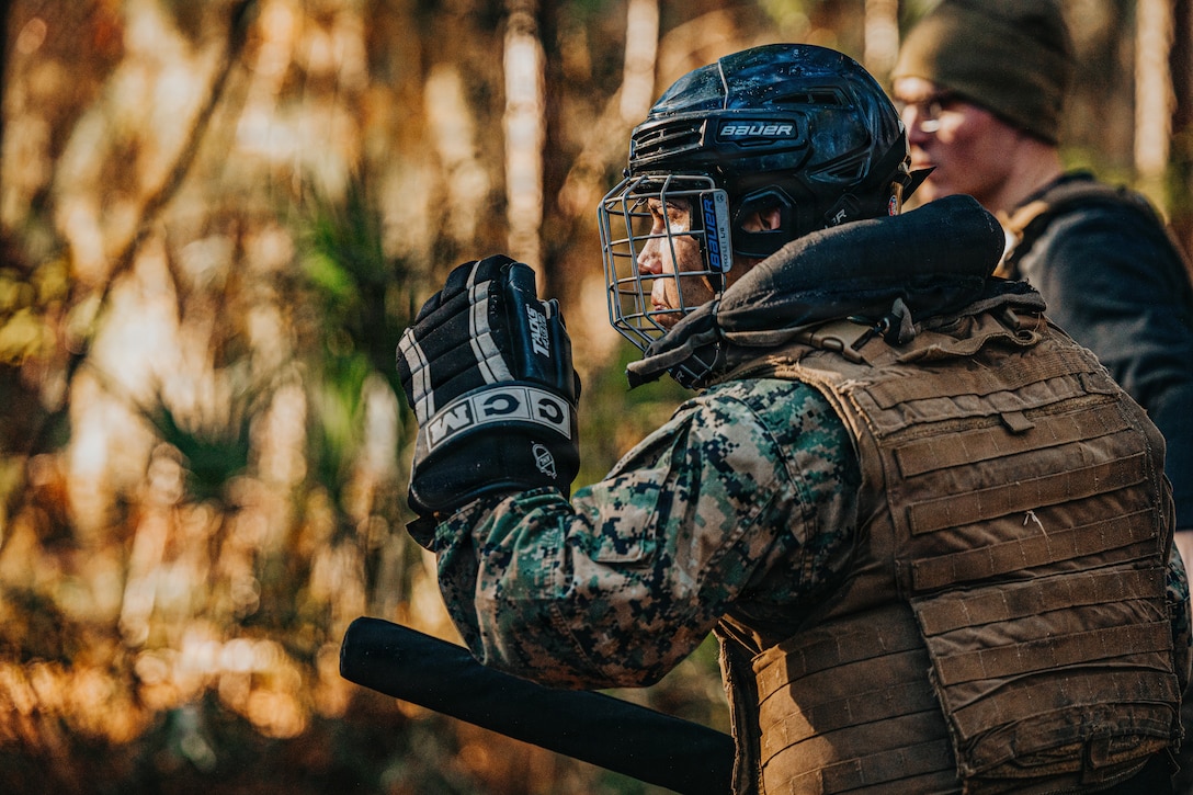 U.S. Marine Corps Cpl. Joel Huayaban, a musician with Headquarters Company, Headquarters and Service Battalion, combat glides to fight during a culminating event for Marine Corps Martial Arts Instructor (MAI) Course on Marine Corps Recruit Depot Parris Island, S.C.