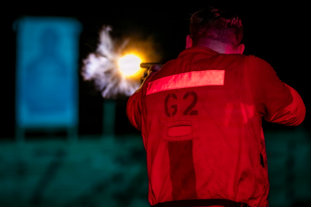 A sailor fires a weapon toward a target, creating an orangish fireball.