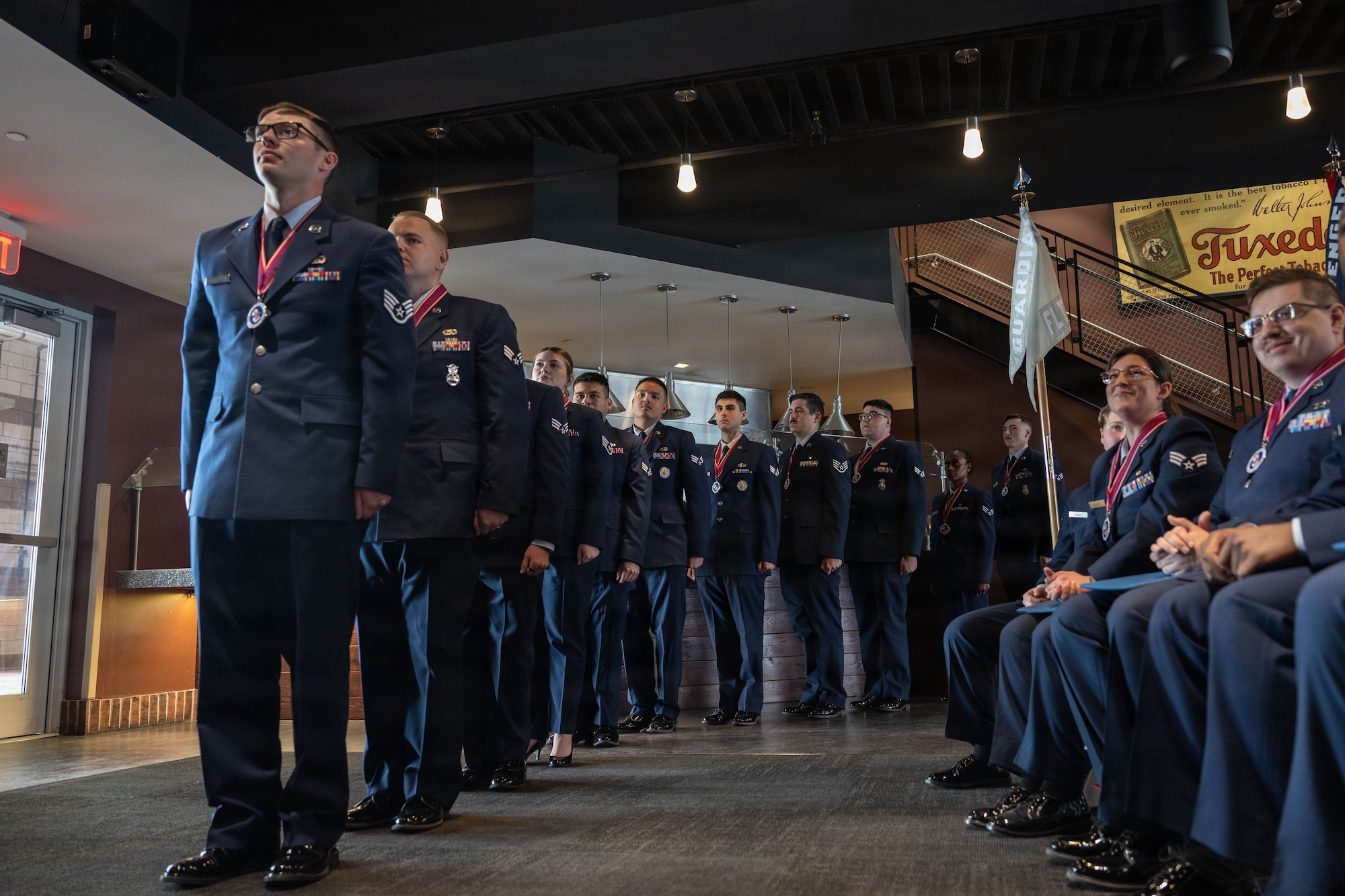 U.S. Airmen from the CMSAF Donald L. Harlow Airman Leadership School class 26 Bravo prepare to receive diplomas during their graduation ceremony at Nationals Park, Washington, D.C., Feb. 12, 2026. ALS is the first level of enlisted professional military education in the Air Force that focuses on developing leadership and communication skills while also developing military professionalism. (U.S. Air Force photo by Airman 1st Class Mauricio Hidalgo)