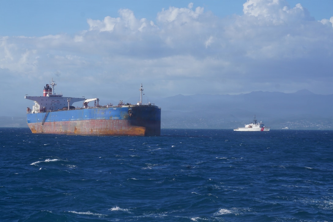 Coast Guard Cutter Mohawk (WMEC 913) transits near motor tanker Veronica while the vessel is anchored off the coast of Ponce, Puerto Rico, Jan. 18, 2026. Mohawk’s crew conducted a 700-nautical-mile escort of the Venezuelan-linked tanker, which was seized by a Coast Guard tactical team with Department of War support three days prior as part of Operation Southern Spear. (U.S. Coast Guard photo)