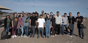 Volunteers from the Laughlin Beautification Team come together for a group photo at Laughlin Air Force Base, Texas, Feb. 7, 2026. The Laughlin Beautification Team hosted their inaugural event at the base’s outdoor track area. (U.S. Air Force photo by Airman 1st Class Darryl Keith)