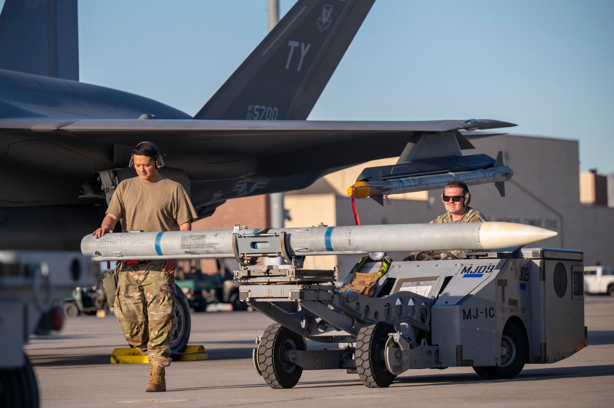 maintainers move a training missile