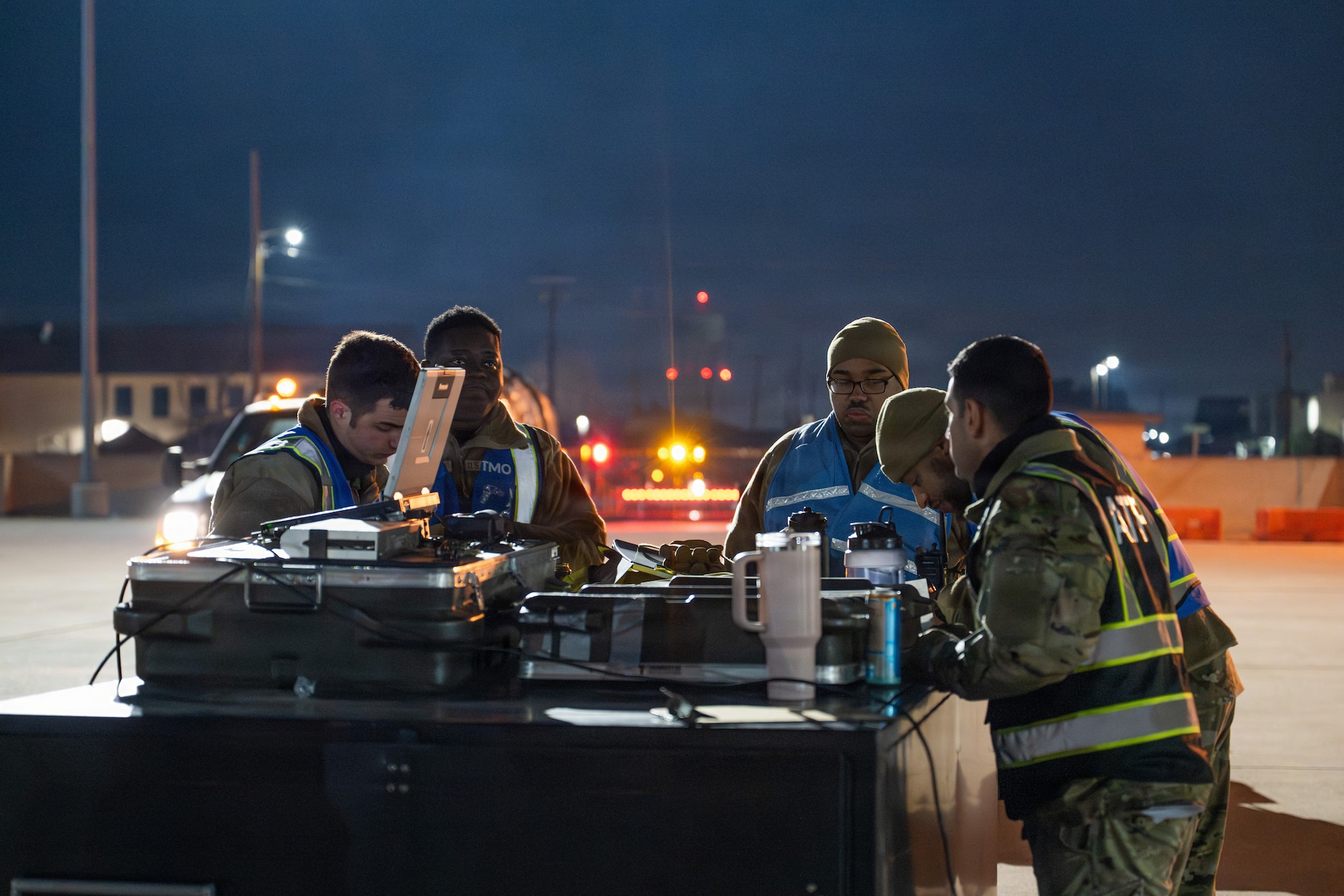 U.S. Airmen assigned to the 7th Logistics Readiness Squadron process cargo through a Cargo Deployment Function line during Exercise DARK ASCENT at Dyess Air Force Base, Texas, Jan. 30, 2026. Deployment processing ensures equipment is properly prepared, documented and ready for rapid movement in support of combat operations. (U.S. Air Force photo by Airman 1st Class Caleb Schellenberg)