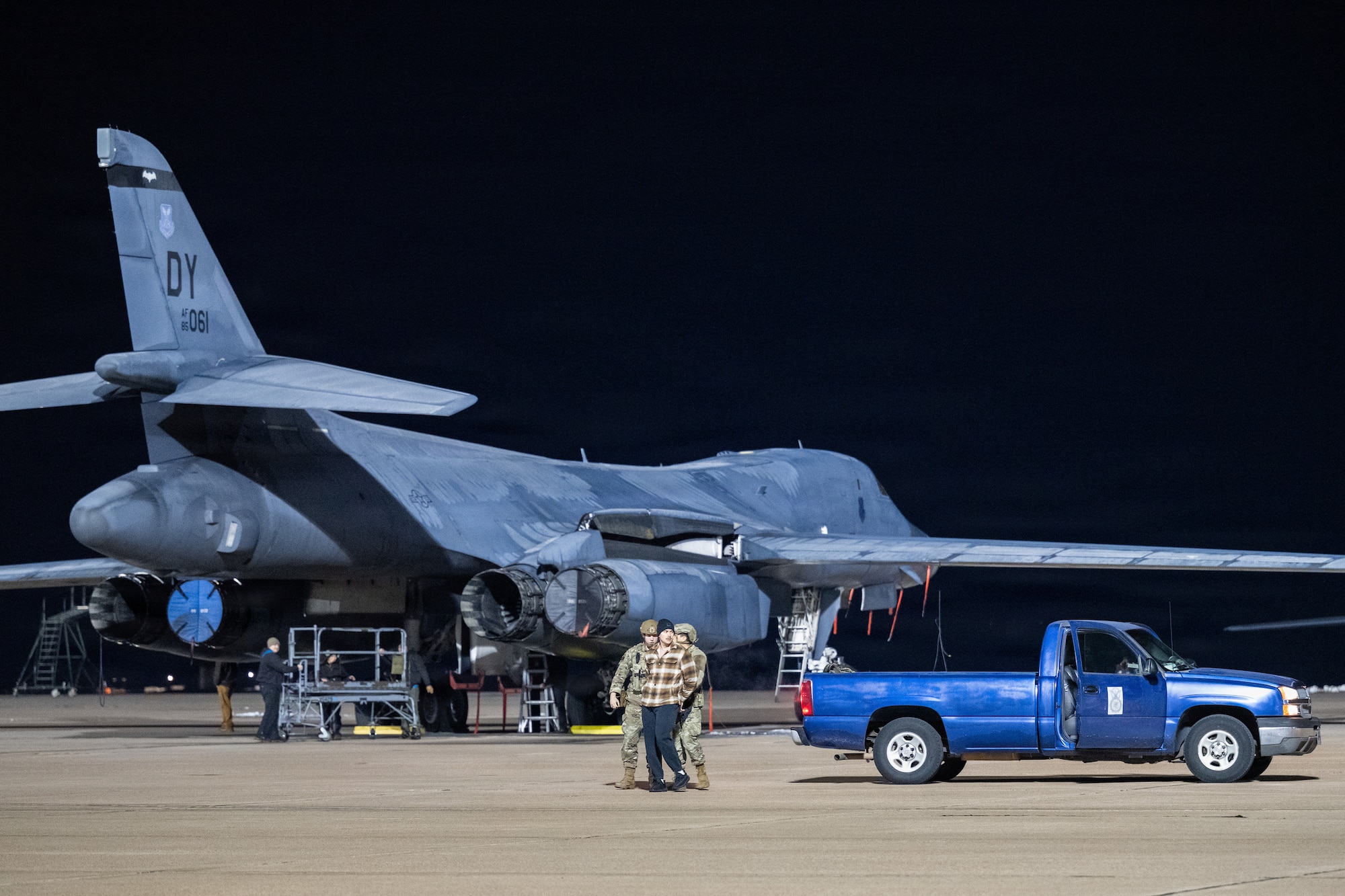 U.S. Air Force Airmen 1st Class Jon Moreno and Gabriel Herring, 7th Security Forces Squadron patrolmen, apprehend a simulated intruder during Exercise DARK ASCENT at Dyess Air Force Base, Texas, Jan. 30, 2026. The exercise scenario evaluated installation defense and flightline security procedures protecting B-1B Lancer aircraft. (U.S. Air Force photo by Airman 1st Class Caleb Schellenberg)