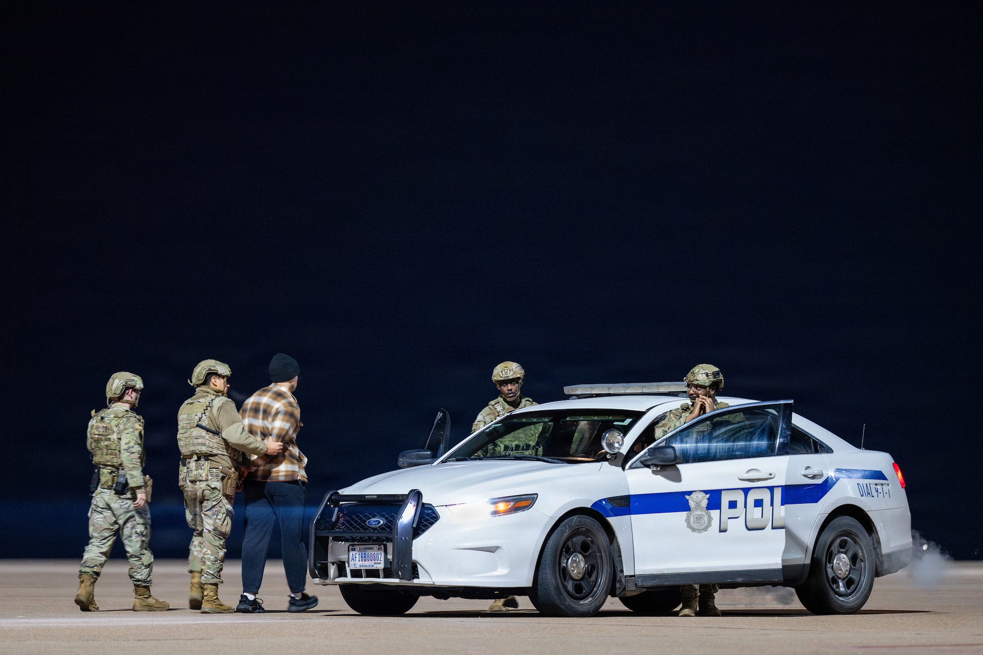 U.S. Airmen assigned to the 7th Security Forces Squadron respond to a simulated security violation on the flightline during Exercise DARK ASCENT at Dyess Air Force Base, Texas, Jan. 30, 2026. Installation defense scenarios tested the 7th Bomb Wing’s ability to protect aircraft and critical resources while deploying and sustaining combat operations. (U.S. Air Force photo by Airman 1st Class Caleb Schellenberg)