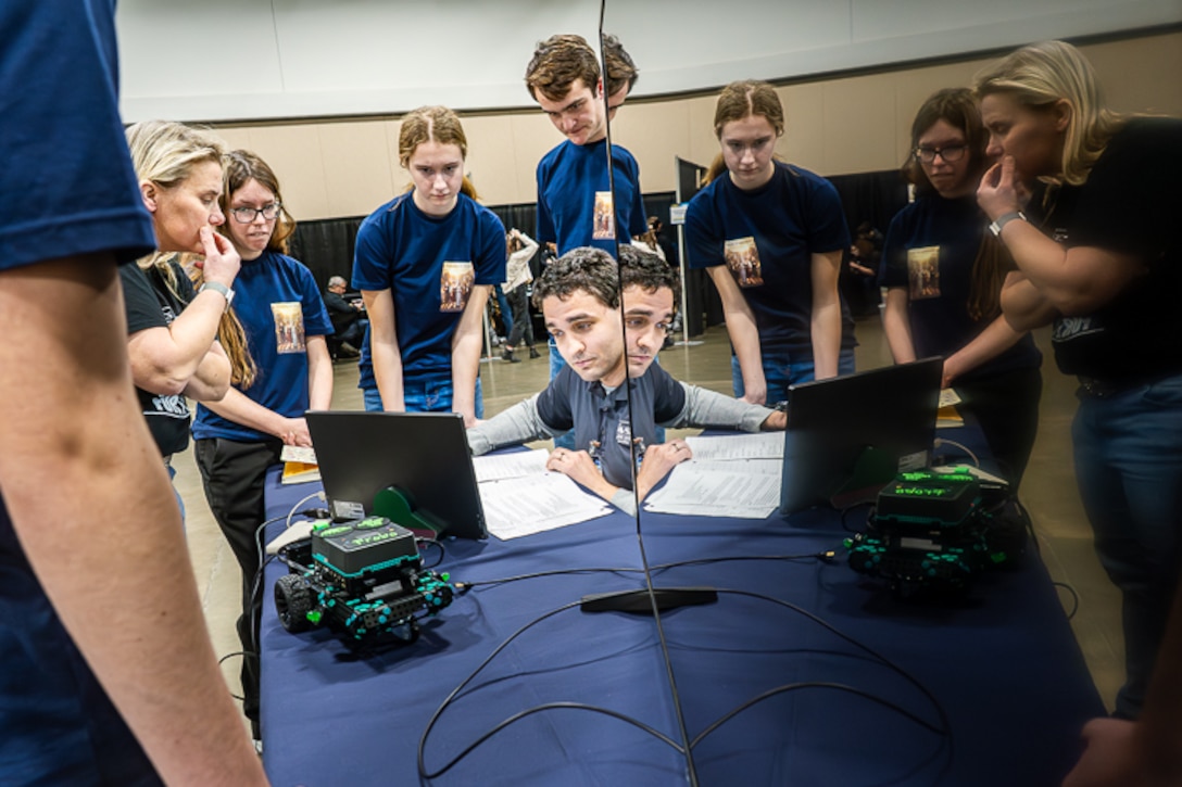 FREDERICKSBURG, Va. – Naval Surface Warfare Center Dahlgren Division STEM advocate Elliot Armstrong runs through Fredericksburg Christian School’s coding after the team’s robot completed a run on the competition course. FCS went on to win first place in the high school category of the 2026 Innovation Challenge @ Dahlgren at the Fredericksburg Convention Center. (Dave Ellis/NSWCDD Photo)