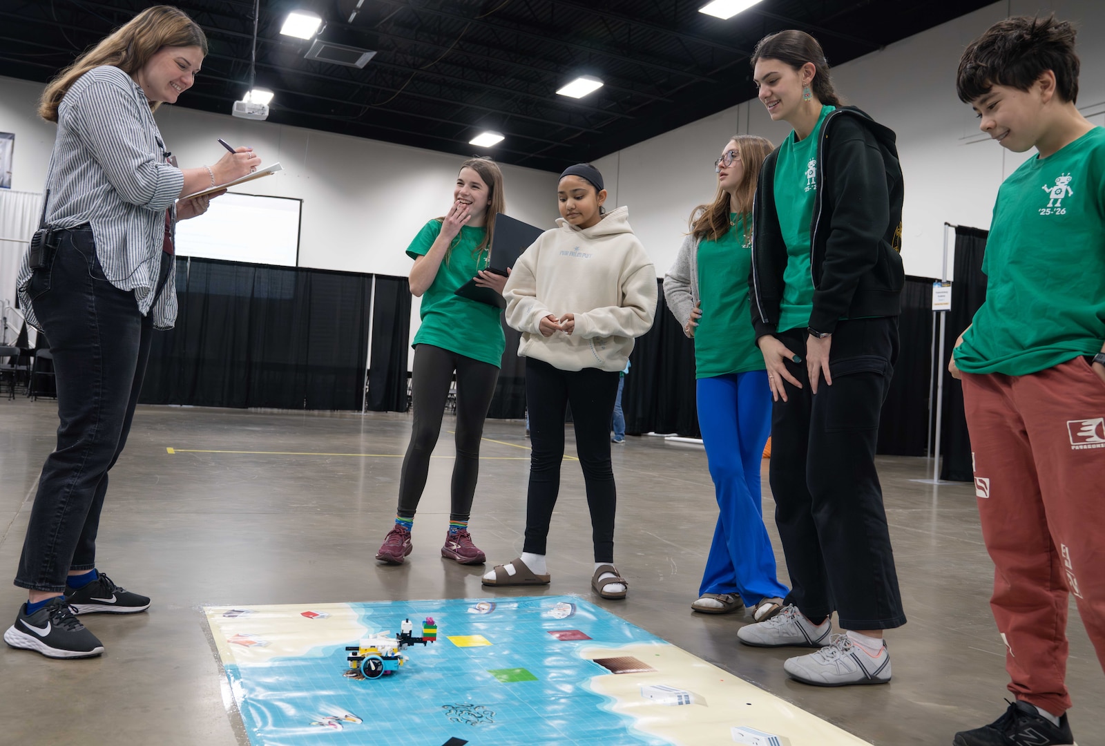 FREDERICKSBURG, Va. – Fredericksburg Academy Team 1 completes a mission run during the Innovation Challenge @ Dahlgren event hosted by Naval Surface Warfare Center Dahlgren Division at the Fredericksburg Convention Center. Students program their robot to navigate a designated course and complete objective-based tasks aligned with competition rubric standards. (Tierney Kunstmann/NSWCDD Photo)