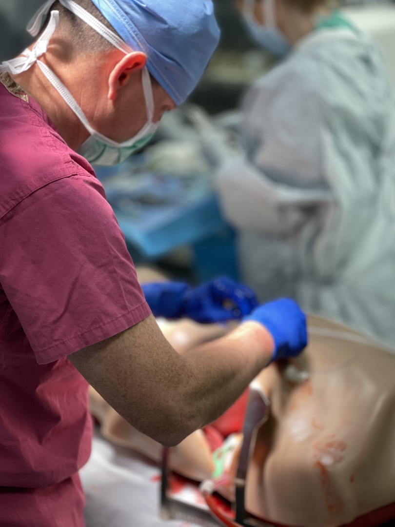 The simulation supports the National Training Center mission by ensuring hospital staff remain proficient and prepared to deliver life-saving care.