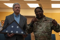 Senator and command chief speaking at an event