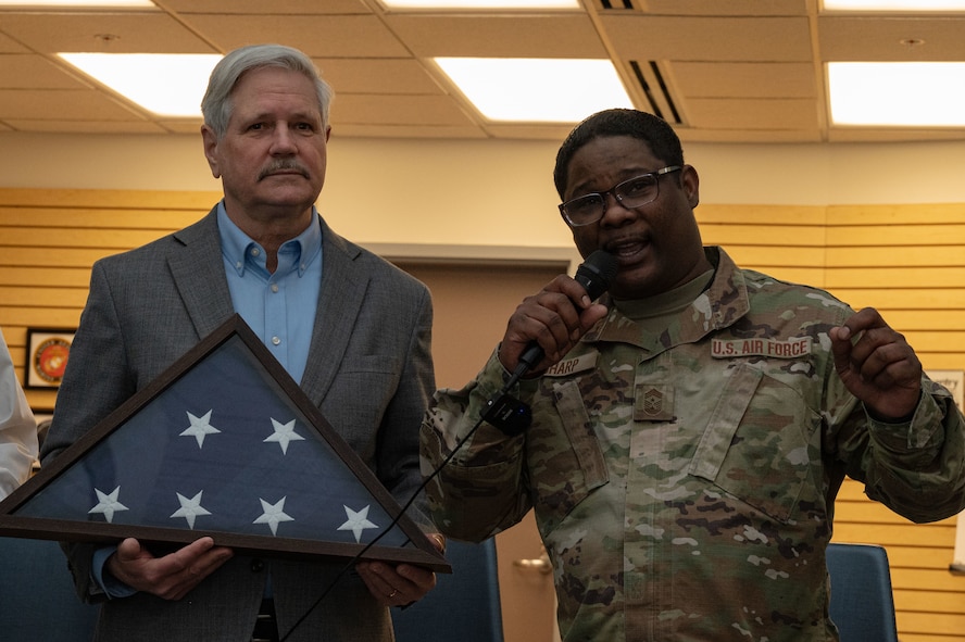 Senator and command chief speaking at an event