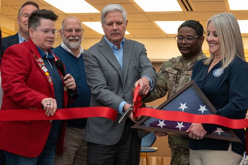 A ribbon being cut