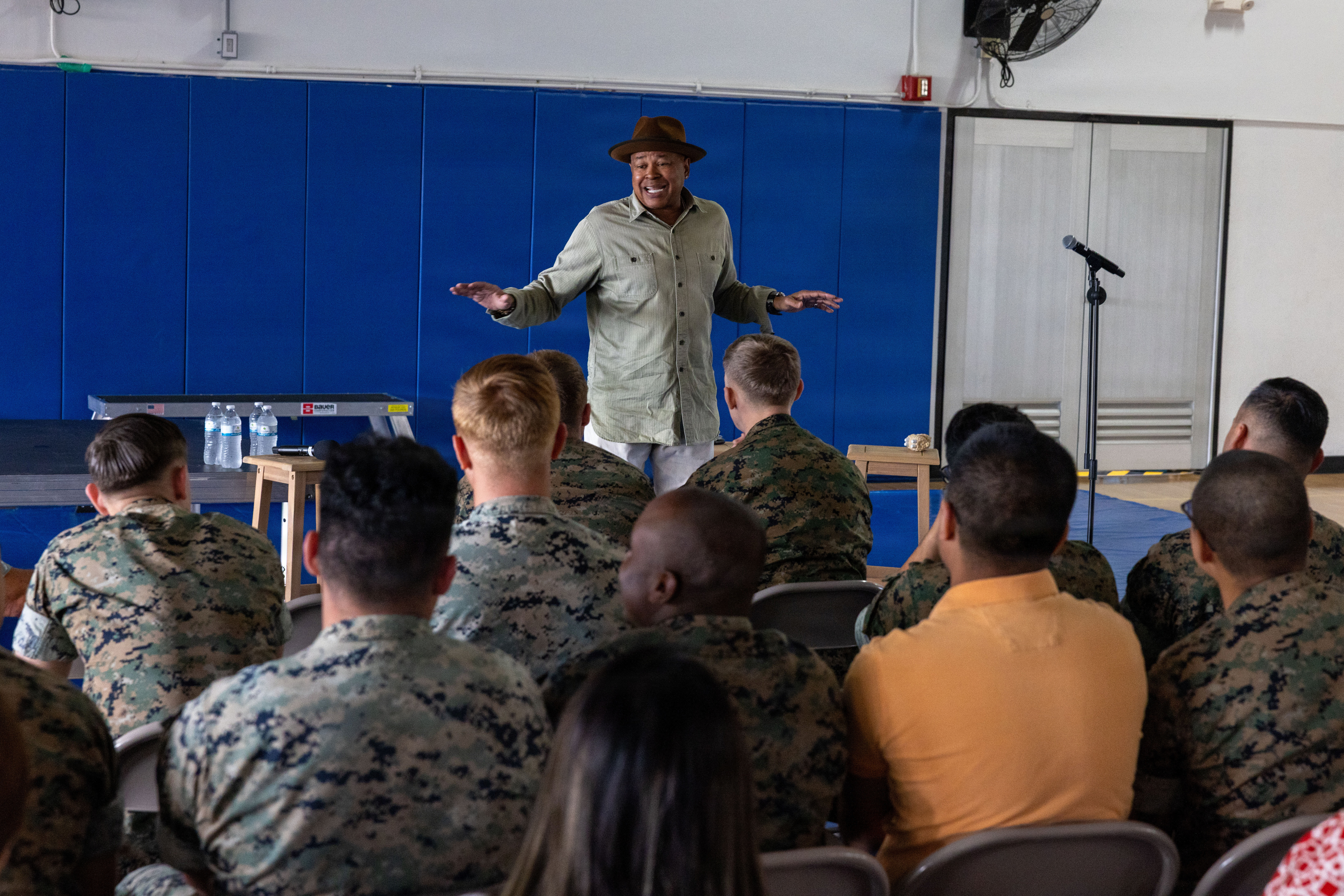 U.S. Marines with Marine Corps Base Camp Blaz interact with a 1st Degree of Separation performer at MCB Camp Blaz, Guam, Feb. 13, 2026. U.S. Marines, staff, and visitors attended the comedy show series “1st Degree of Separation” aimed at ending the stigma of mental illness, providing a lighthearted alternative to suicide prevention training. (U.S. Marine Corps photo by Lance Cpl. Afton Smiley)