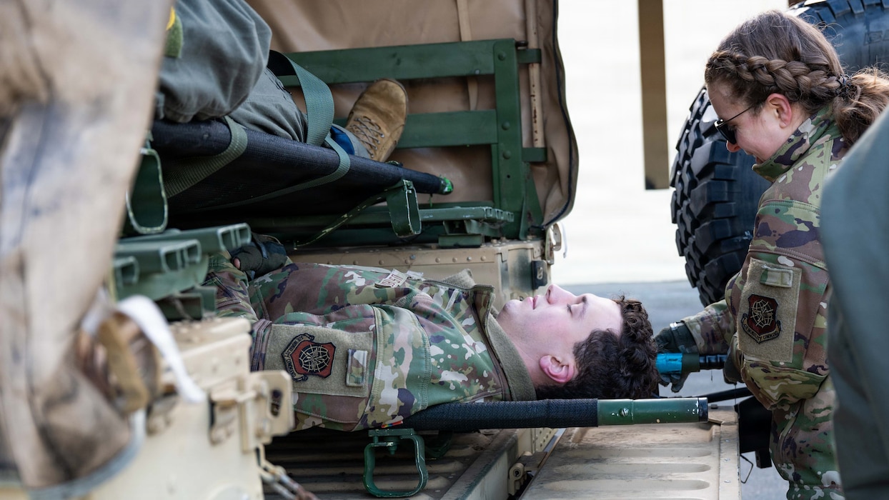 Airmen transport a simulated patient