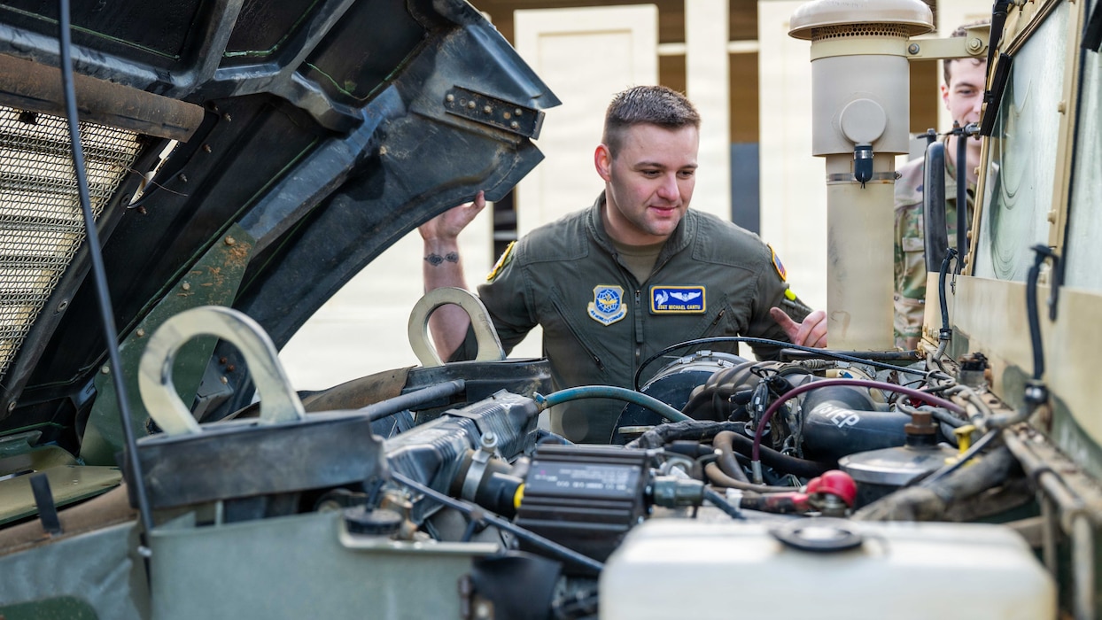 Airman inspects a Humvee