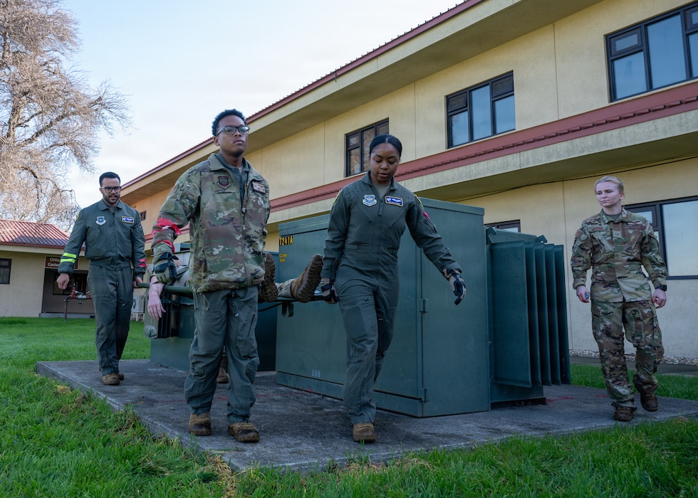 Airmen carry patient litter