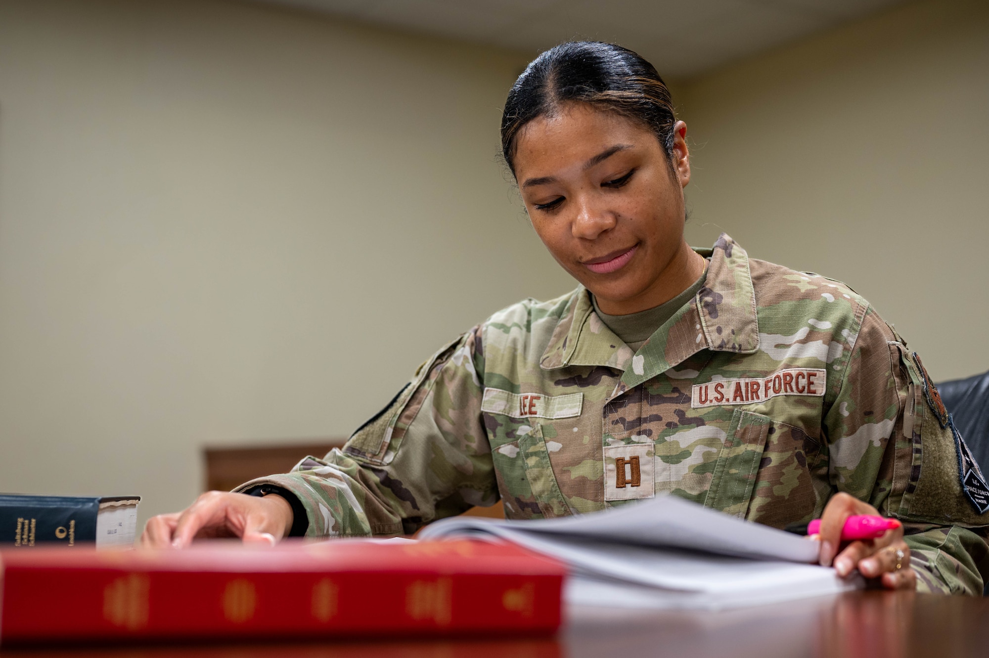 U.S. Air Force Capt. Angelique Lee, Trial Defense Division, Area Defense Counsel, reviews case documents at Kadena Air Base, Japan, Feb. 17, 2026. Operating separately from the base legal office, the ADC represents individual Airmen and Guardians; safe-guarding their rights throughout the military justice process. (U.S. Air Force photo by Airman 1st Class Nathaniel Jackson)