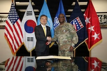 U.S. Army Gen. Xavier Brunson, commander of United Nations Command, Combined Forces Command and United States Forces Korea, shakes hands with Republic of Korea Minister of Foreign Affairs Hon. Cho Hyun at the UNC and USFK Headquarters on Camp Humphreys, South Korea, Feb. 13, 2026.
