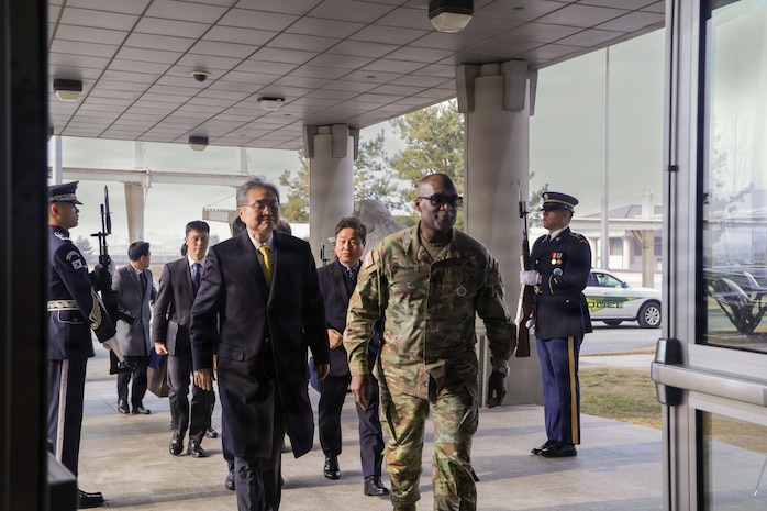U.S. Army General Xavier Brunson walks with Republic of Korea Foreign Minister Hon. Cho Hyun and other National Assembly members as they arrive to United Nations Command and U.S. Forces Korea headquarters at Camp Humphreys, Feb. 13, 2026.
