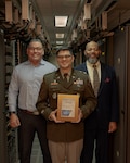 Alejandro Gonzalez, Information Management Division chief, Army Lt. Col. Bruce Barnes, chief information officer, and Walter Walsh, deputy chief information officer, show the 2025 Digital Health Most Wired award at Brooke Army Medical Center, Joint Base San Antonio-Fort Sam Houston, Texas, Jan. 29, 2026. Among the more than 50,000 facilities represented, BAMC ranked above its peers in key focus areas including infrastructure, cyber security, administration, supply chain, analytics/data management and patient engagement. (Courtesy Photo)